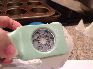 I use a scrapbooking punch to make my snowflakes out of very thing, slightly dry gumpaste.  Works like a charm!!!